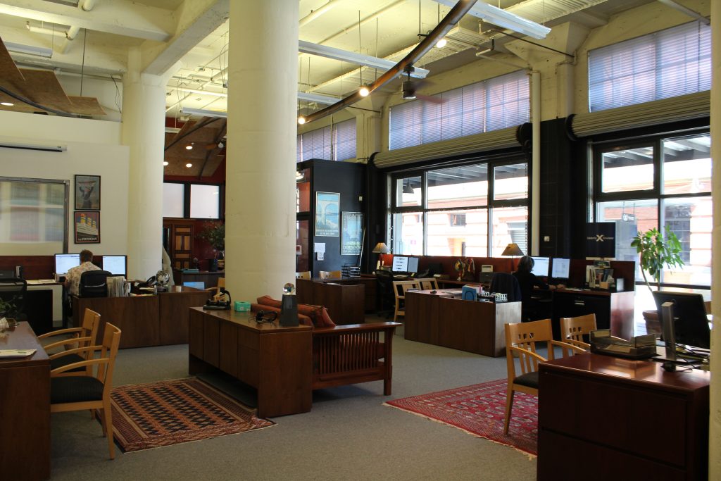 About us. Image shows a warm and inviting office for a travel agency in Portland, Oregon. 